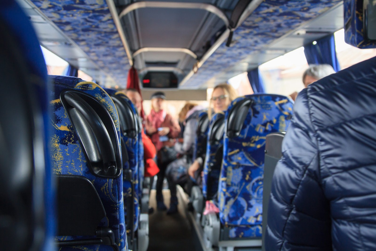 View from inside the bus with passengers.